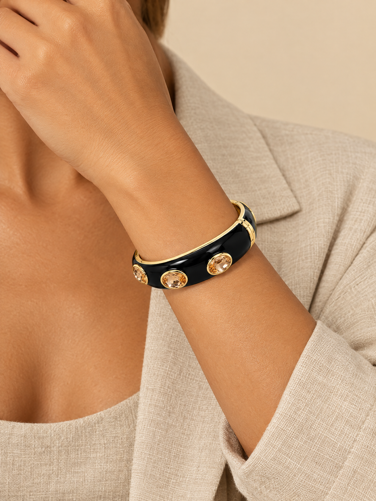 ATTICO black oval faceted bangle on wrist