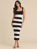 ATTICO Striped Shoulder Bow Knit Midi Dress - Black / White | editorial model, warm beige #E7D9C5 studio background